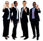 Corporate Team Showing Ok Sign Stock Photo