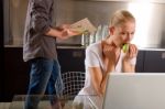 Couple At Home Using Laptop Stock Photo