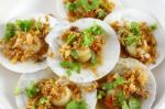 Shell Sea Food In Fried Garlic And Parsley Stock Photo