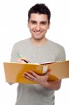 Man Studying With Dossier Stock Photo