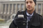 Man With Mobile Phone In Hands Stock Photo