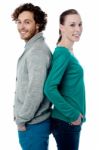 Fashion Couple Posing Back To Back Stock Photo