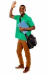 African Male Holding Book And Bag Stock Photo