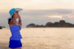 Visitors Woman Looking The Sunrise Over The Sea Stock Photo