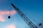 Construction Crane On Evening Background Stock Photo