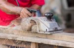 Carpenter Working With Electric Planer Stock Photo