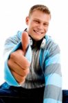 Young Happy Male With Headphones And Thumbs Up Stock Photo