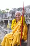 An Unidentified Old Buddhist Female Monk Dressed In Orange Toga Stock Photo