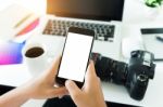 Creative Photogeapher Holding Phone White Screen On Workspace Ta Stock Photo