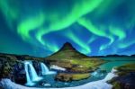 Northern Light, Aurora Borealis At Kirkjufell In Iceland. Kirkjufell Mountains In Winter Stock Photo