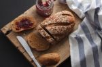 Dark Multigrain Bread Whole Grain And Jam Fresh Baked On Rustic Closeup Stock Photo