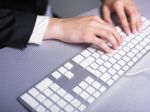 Woman Hand Typing On Keyboard Stock Photo