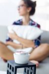 Beautiful Young Woman Relaxing On Sofa At Home Stock Photo