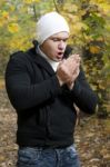 Man Shivering In Cold Winter Stock Photo