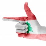 Lebanon Flag On Shooting Hand Stock Photo