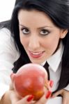 Young Student Holding An Apple Stock Photo