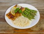 Salmon Dinner On A Rustic Background Stock Photo