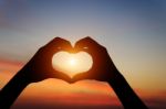 Silhouette Hand Gesture Feeling Love During Sunset Stock Photo