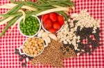 Variety Of Kitchen Ingredients With Fresh And Dried Legumes Stock Photo