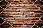 Fence And Brick Wall Stock Photo