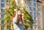 Young Beautiful Woman Playing Badminton Stock Photo