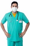 Handsome Male Nurse With Hand On Hips Stock Photo