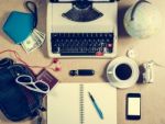 Typewriter And Personal Items On The Table Stock Photo