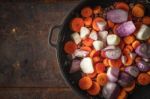 Shallot And Carrots In The Pan On The Metal Background Stock Photo