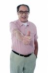 Aged Male Gesturing Thumbs Up Stock Photo