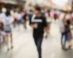 Blurred People Walking On The Street Stock Photo