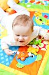 Infant Boy On Playmat Stock Photo