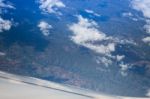 Cloudy Sky View From Airplane Cabin Window Stock Photo