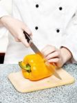 Chef Cutting Bell Peppers Stock Photo