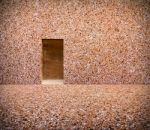 Stone Wall With Door And Stone Floor In Front Off Stock Photo