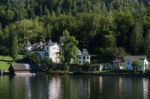 Castle Schloss On The Shoreline Of Lake Hallstatt Stock Photo