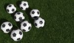 Soccer Balls On Green Grass Stock Photo