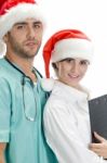 Couple Doctors Wearing Santa Hat Stock Photo