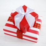 Red Gift Box With White Ribbons Stock Photo