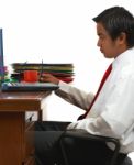 Office Worker Looking At Notebook Stock Photo