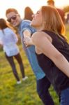 Portrait Of Group Of Friends Having Fun In Field Stock Photo