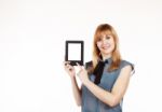 Young Beautiful Woman Holding A Tablet Stock Photo