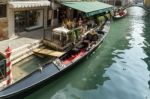 Restaurant Alongside A Canal In Venice Stock Photo