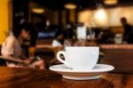 Cup Of Coffee On Table In Cafe Stock Photo