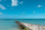 Path Walk Way Wall Extend To Clean Blue Sea On Nice Blue Cloud Sky Vacation Day Stock Photo