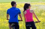 Happy Young  Couple On A Bike Ride In The Countryside Stock Photo