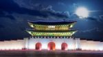 Gyeongbokgung Palace And Full Moon At Night In Seoul, South Korea Stock Photo