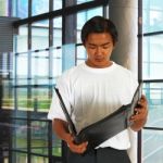 Man Holding The File Stock Photo