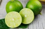 Lime Cut On Wooden Stock Photo