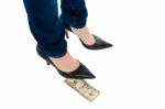 Woman In Stilettos Standing Over Ten Dollar Note Stock Photo