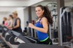 Beautiful Brunette On A Treadmill Stock Photo